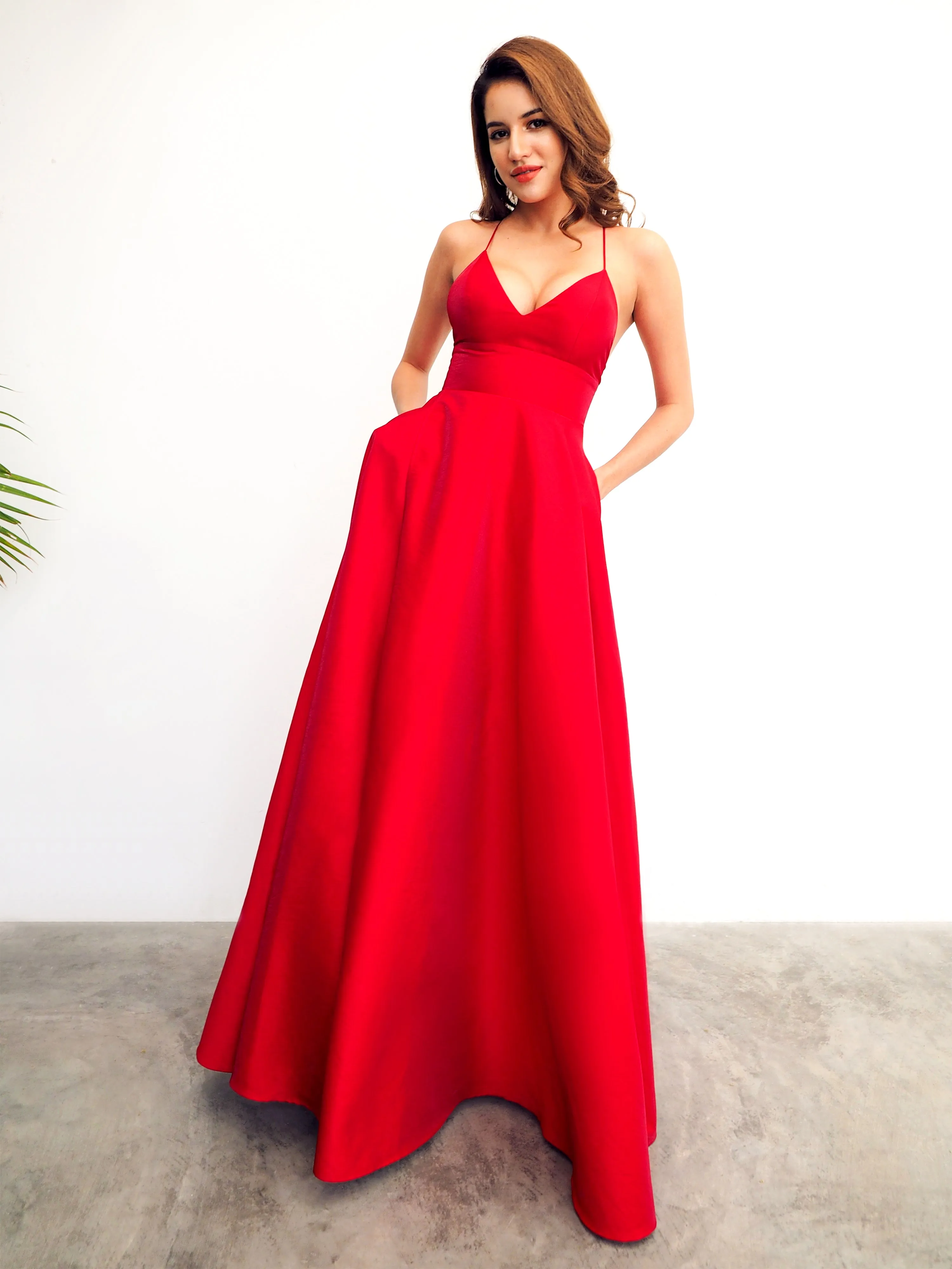 Red satin v-neck full dress with slit and lace up back