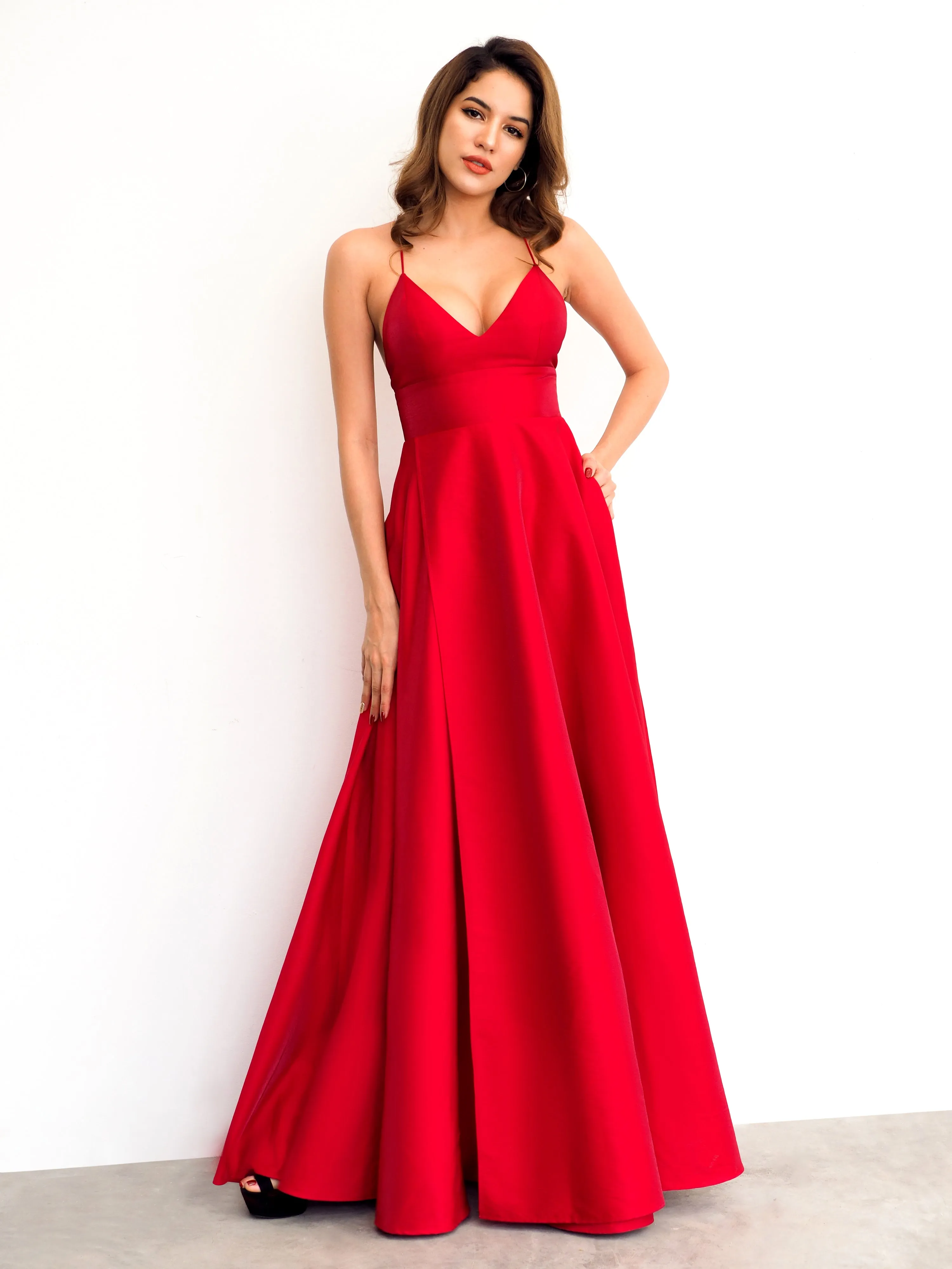 Red satin v-neck full dress with slit and lace up back