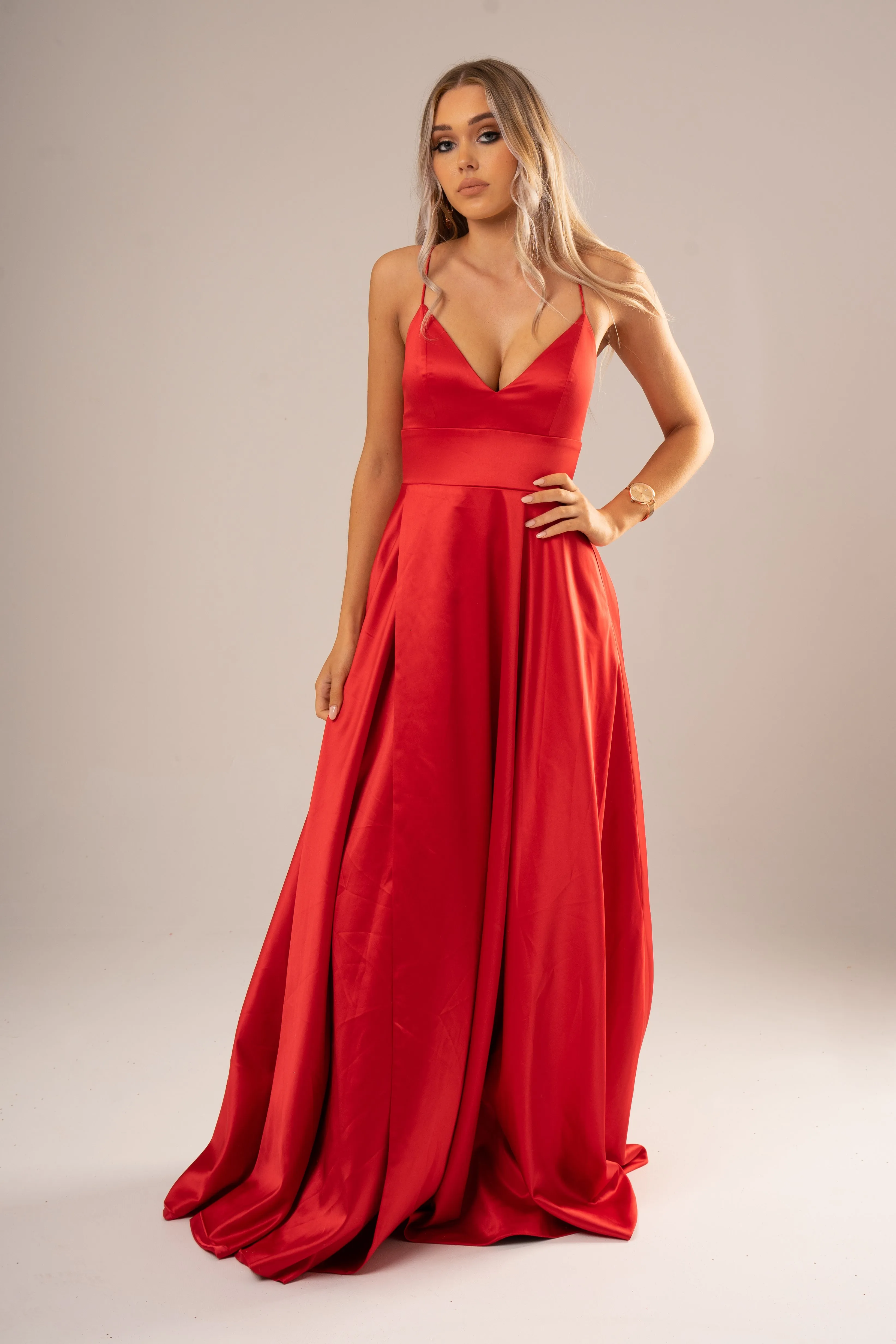Red satin v-neck full dress with slit and lace up back