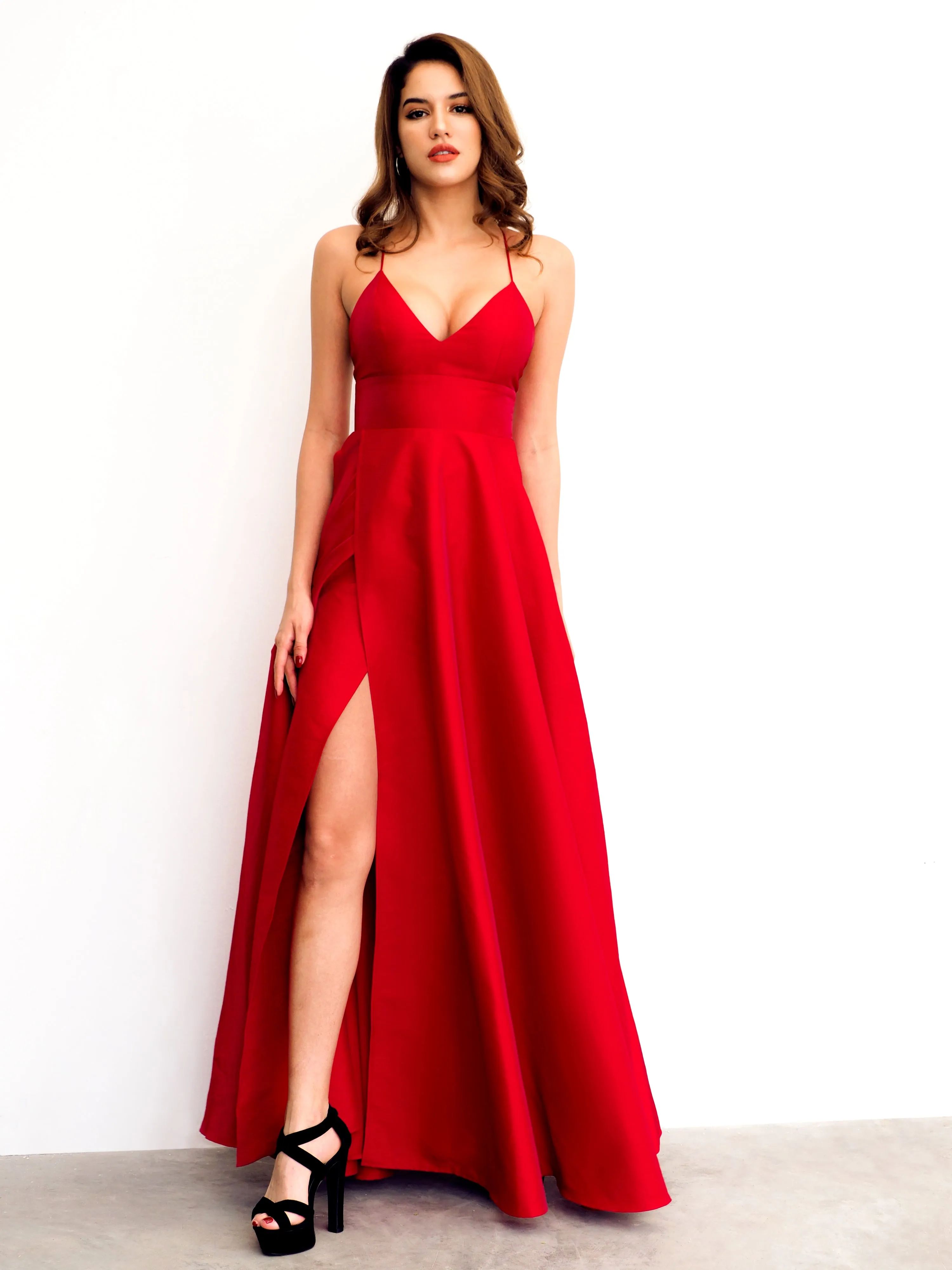Red satin v-neck full dress with slit and lace up back